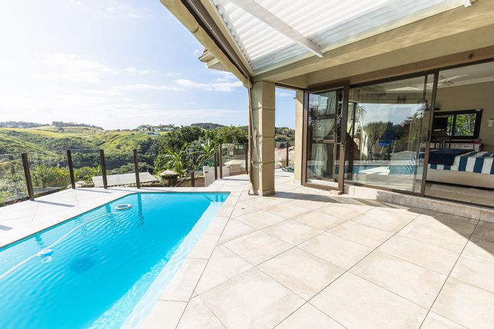 Modern 4-Bedroom House for Sale at Shelly Beach with River Frontage & Pool!