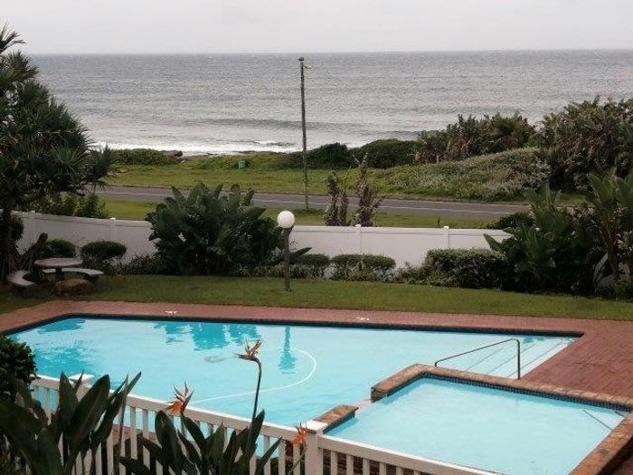 Uvongo Beachfront Apartment for Sale: 2 Bedrooms, Pool, Tennis, Direct Beach Access!