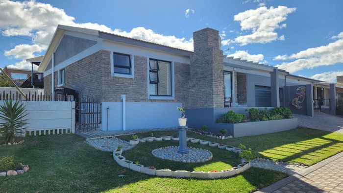 House for Sale in Dana Bay: Open plan living, three bedrooms, double garage, outdoor braai.