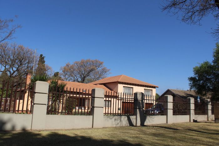 Spacious Rynfield house for sale with 5 bedrooms, braai area, and triple garage.