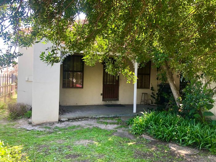 2-Bedroom House For Sale in Fairview Golf Estate with garage and outdoor braai area.