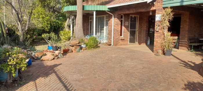 House for Sale in Pretoria North: 1.5 bedrooms, open-plan living, secure garage.