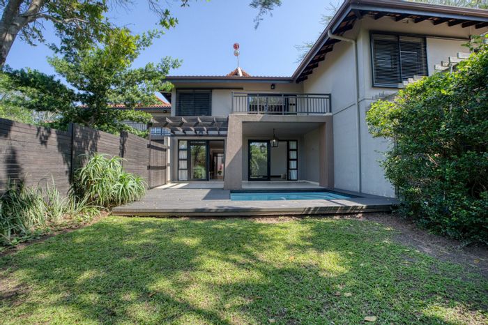 Zimbali Townhouse To Rent: Pool, garden, golf course access, and secure parking.