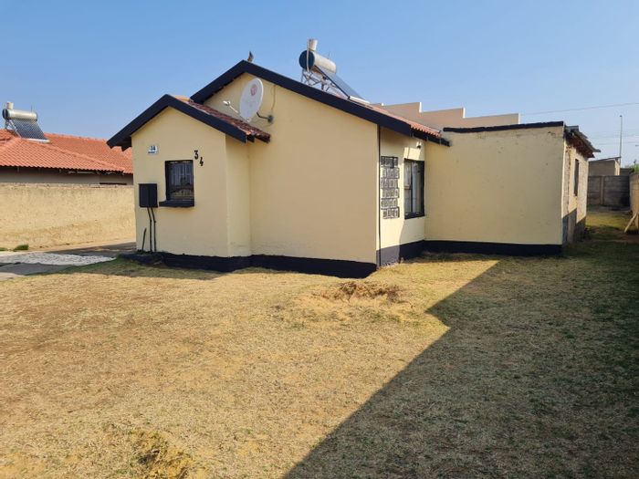 For Sale: House in Lenasia South with spacious yard and rental potential.