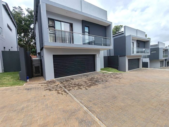 For Sale: Bryanston Townhouse with 4 en-suite bedrooms, garden, and 24-hour security.