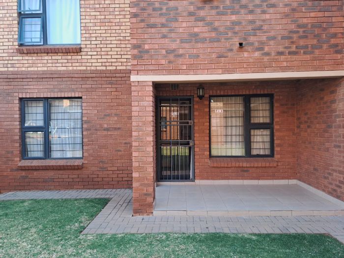 Spacious 2-bedroom townhouse in Olympus Heights Estate, For Sale with open-plan living.