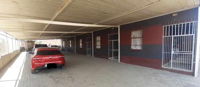 For Sale: House in Botshabelo with 5 bachelor units and rental income potential.