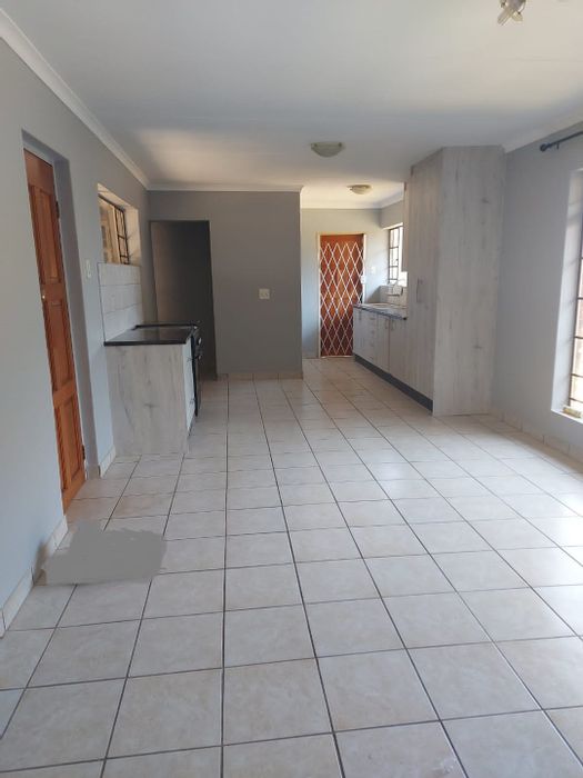 2 Bedroom Apartment To Rent in Rietvalleirand with private garden and secure parking.