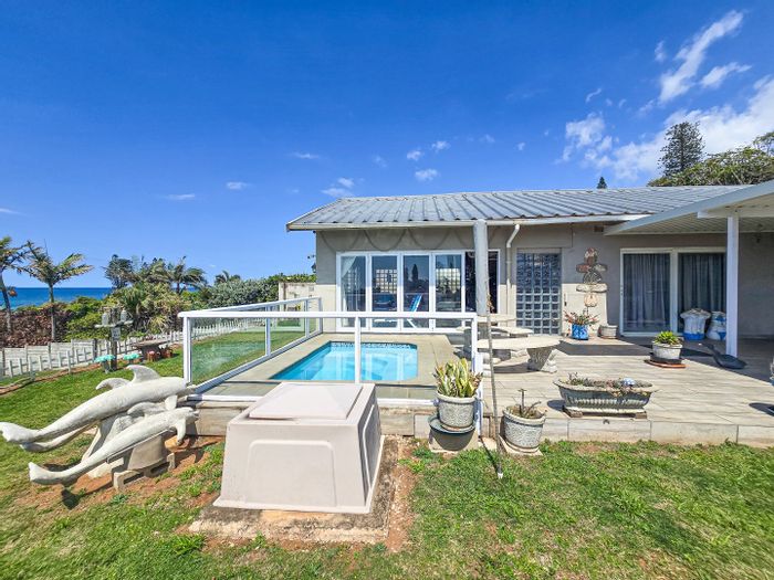 Beachfront house in Southport for sale: open-plan living, pool, guest flat.