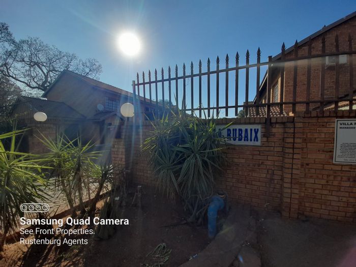 For Sale: Apartment in Rustenburg Central with open plan living, 2 baths, garage.