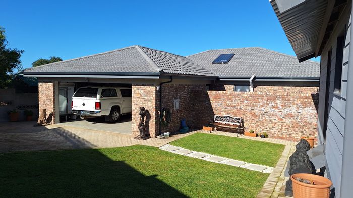 House For Sale in Dana Bay: Indoor braai, outbuilding potential, spacious living.