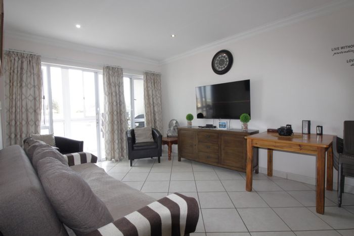 For Sale: Apartment in Jeffreys Bay Central with beach access, balcony, and secure parking.