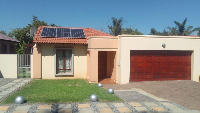 Kyalami Hills House For Sale: Solar power, 24-hour security, landscaped garden, double garage.