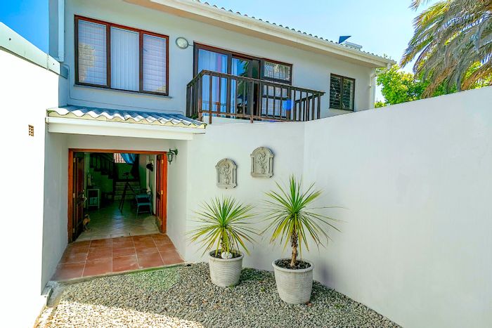 House For Sale in Costa Sarda: Multiple rental units, private garden, and parking.