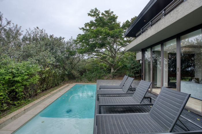 Zimbali House For Sale: 4 bedrooms, en-suites, bar area, open living spaces.