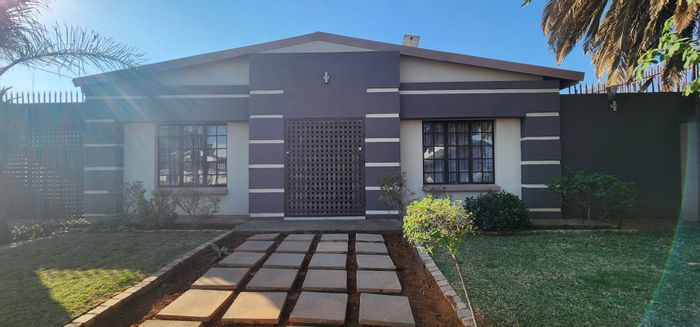 For Sale: Spacious 5-bedroom house in Laudium with dual kitchens and ample parking.