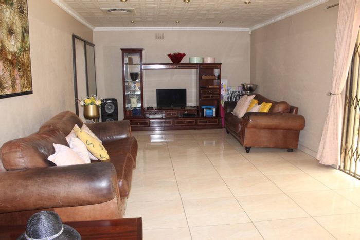 For Sale: House in Van Riebeeck Park with 4 bedrooms, secure features, and garden.