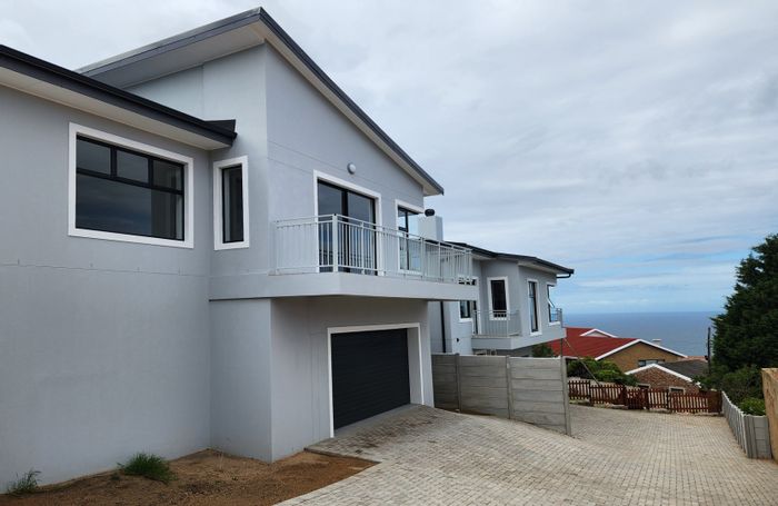 For Sale: House in Dana Bay with sea views, open plan living, and double garage.