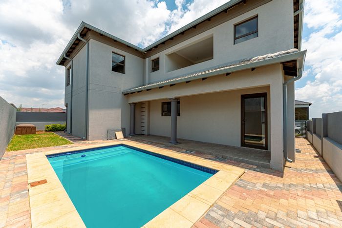 House for Sale in Wildtuin Park: Pool, garden, en-suite bedrooms, gym, game reserve access.