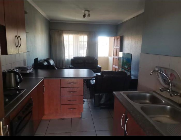 For Sale: Apartment in Germiston South with 2 bedrooms, balcony, and community amenities.