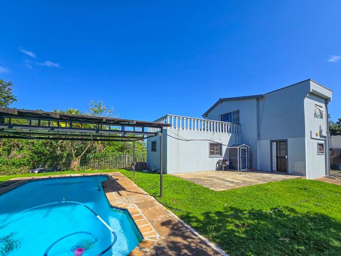 For Sale: Leisure Bay House with pool, garages, and spacious balconies.