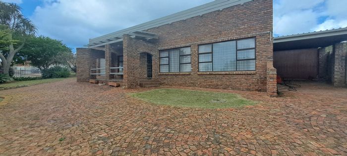 For Sale: House in Hartenbos Heuwels with solar panels, guest toilet, and secure living.