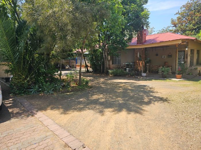 Spacious Noordhoek house for sale with flat, garden, and ample parking.