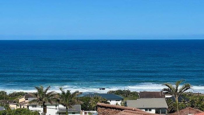 Uvongo House For Sale: 3 Bedrooms, ocean views, deck, pool, and garage.