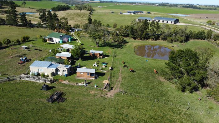 Farm for Sale in Wilderness Rural: 2-bedroom house, electric fencing, multiple outbuildings.