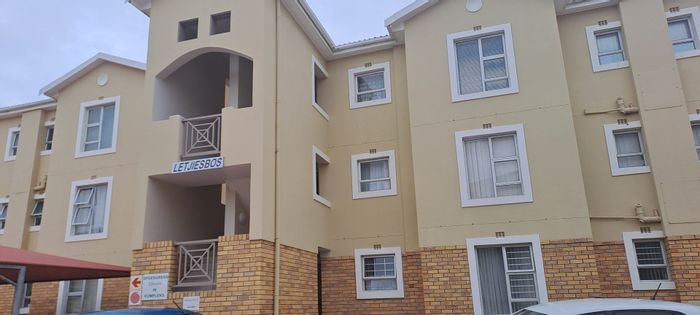 Top floor apartment for sale in Hartenbos Central, includes garage and furniture.