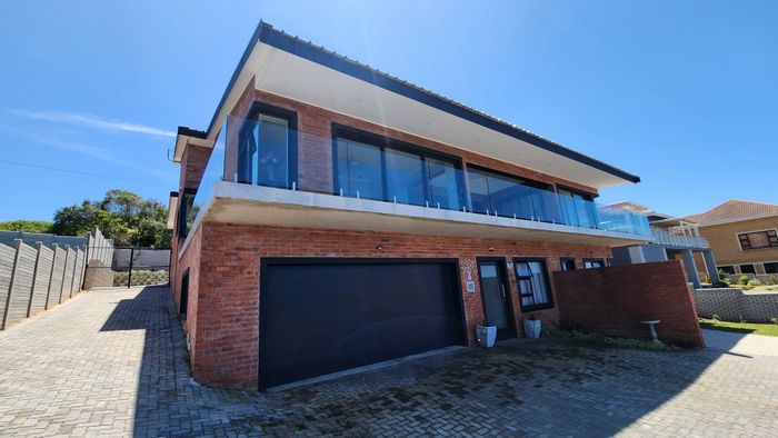 Tergniet House For Sale: Ocean views, dual living unit, spacious garage, and braai area.