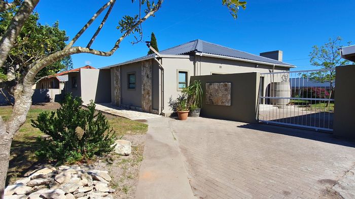 For Sale: House in Albertinia Central with spacious garden, braai room, and double garage.