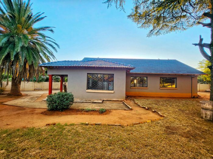 3-bedroom house in Stilfontein Central for sale, fully enclosed yard, upgrade potential.