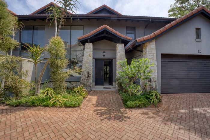 Zimbali Townhouse To Rent: Open-plan living, private patio, access to amenities.