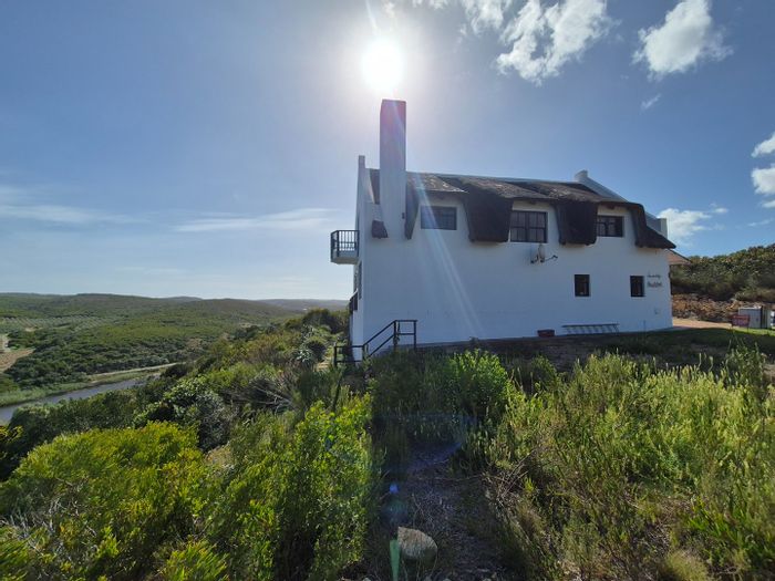 For Sale: House in Stilbaai Oos with river views, terrace, and eco-friendly features.