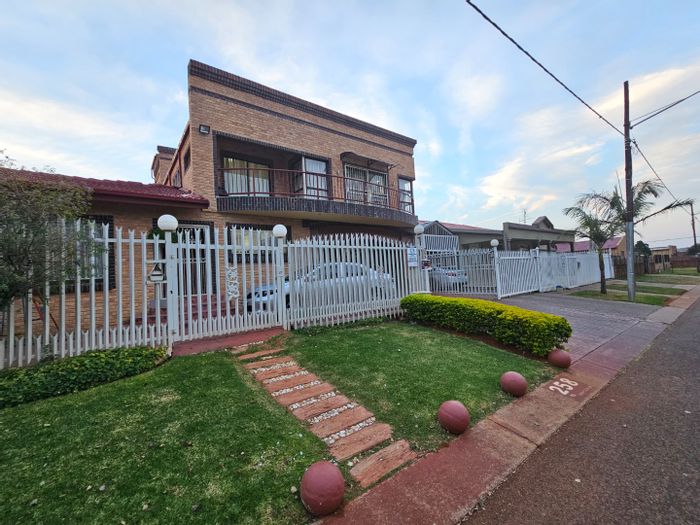 For Sale: 9-Bedroom House in Laudium with multiple kitchens, garages, and scenic views.