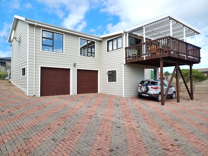 Reebok House For Sale: 3 bedrooms, open-plan living, double garages, low-maintenance garden.