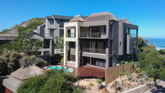 For Sale: House in Wilderness Central with pool, balconies, bar, and ocean views.