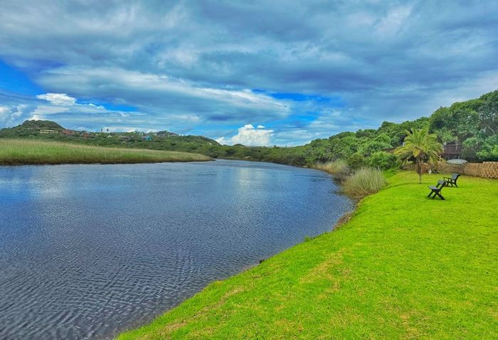 Waterfront house for sale in Wilderness Central with communal pool and river access.