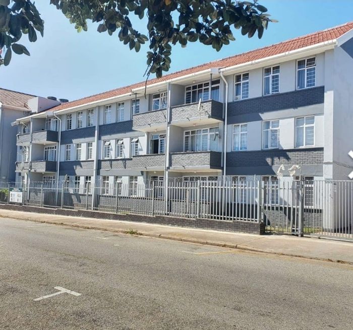 Two-bedroom apartment for sale in Port Elizabeth Central with secure parking and rental income.