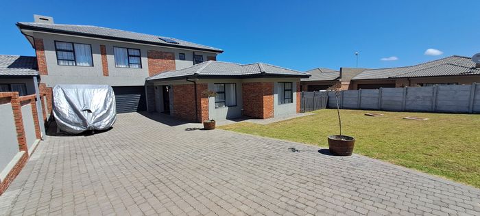 For Sale: House in Reebok with 3 beds, double garage, and outdoor space.