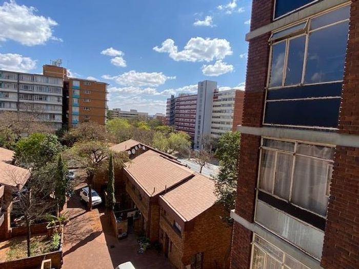 For Sale: Income-Generating Apartment in Pretoria Central with Flexible Layout and Security.