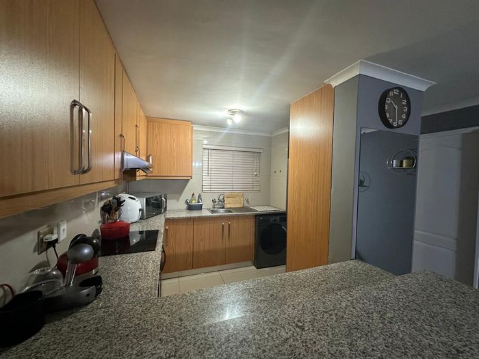 For Sale: 2-Bedroom Townhouse in Goodwood Central with secure parking and pool access.