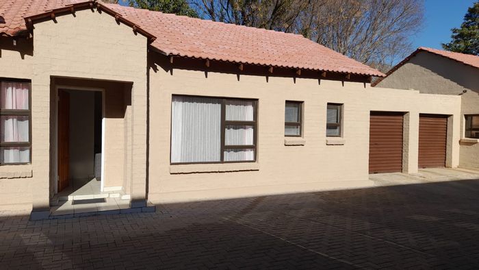 For Sale: 3-Bedroom Townhouse in Wilkoppies with courtyard, garage, and security features.