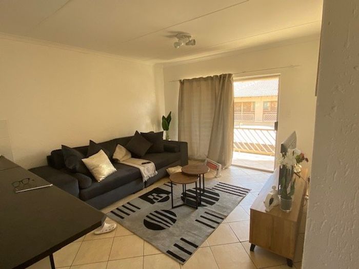 For Sale: Rensburg Apartment with open-plan living, balcony, and secure complex.