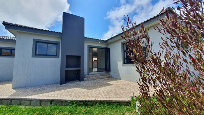 For Sale: House in Dana Bay with open-plan living, outdoor braai, and double garage.