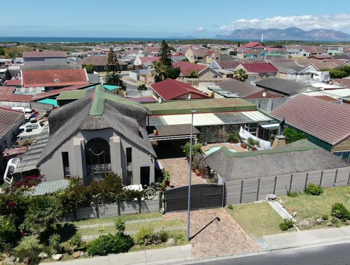 For Sale: House in Strandfontein Village with pool, Lapa, and ample parking.