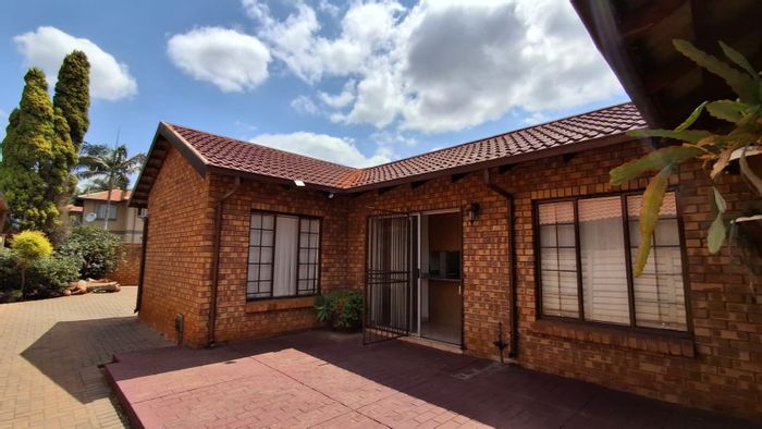 For Sale: House in Doornpoort with 4 bedrooms, spacious living areas, and security.