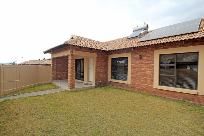 For Sale: Helderwyk Townhouse with garden, garage, pool, gym, and solar system.