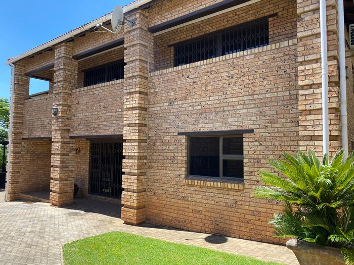 4-Bedroom Townhouse To Rent in Signal Hill with pool, garden, and security features.